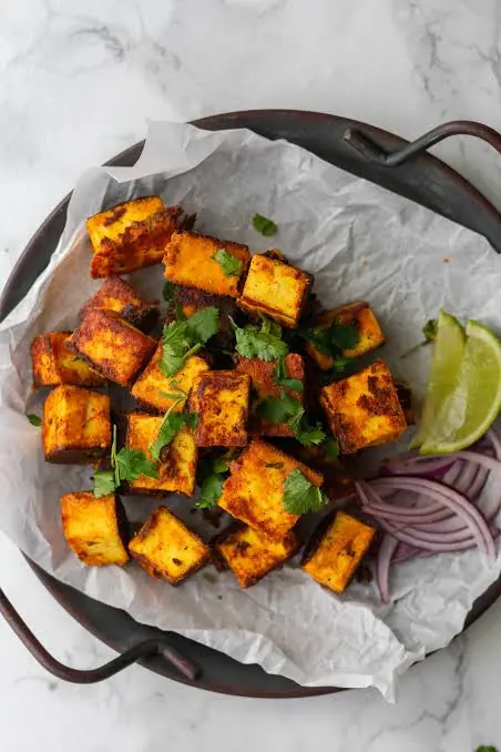 Paneer tikka grilled with peppers and onions, served with mint chutney